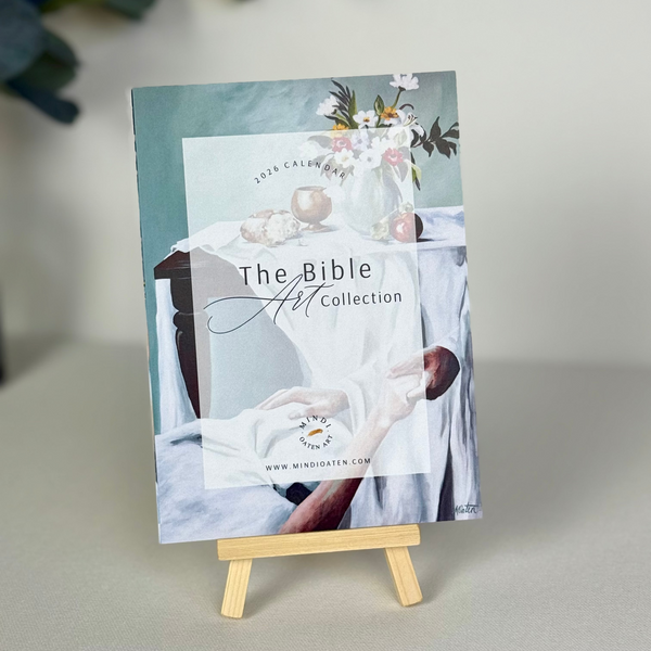 2026 Bible Art Calendar by Mindi Oaten – The Bible Art Collection cover on easel.