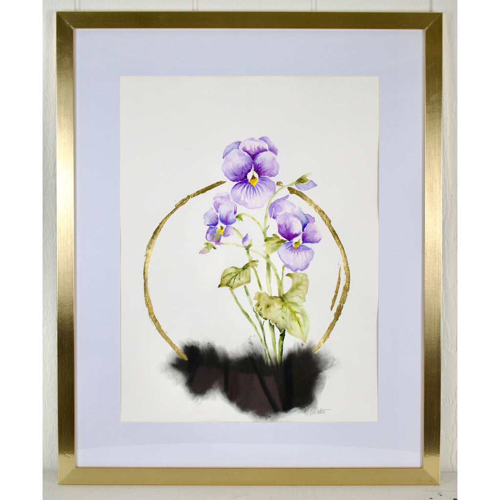Framed artwork of purple flowers with a gold border on a light background