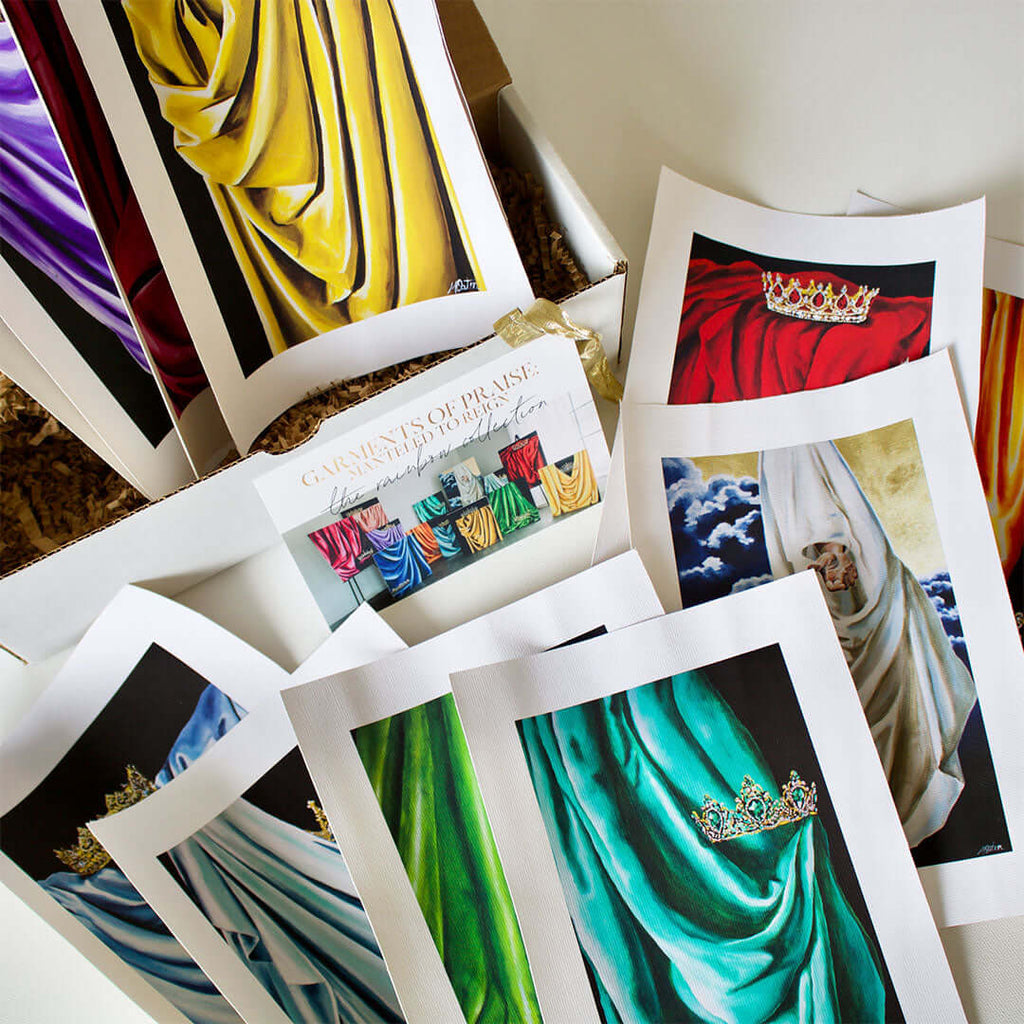 

An open box with colorful drapery prints and an information card.