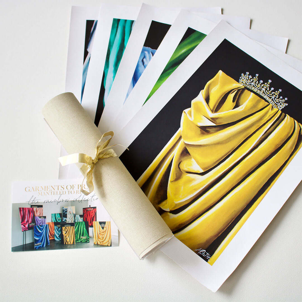 

Colorful canvas prints beside a tied canvas roll and information card.