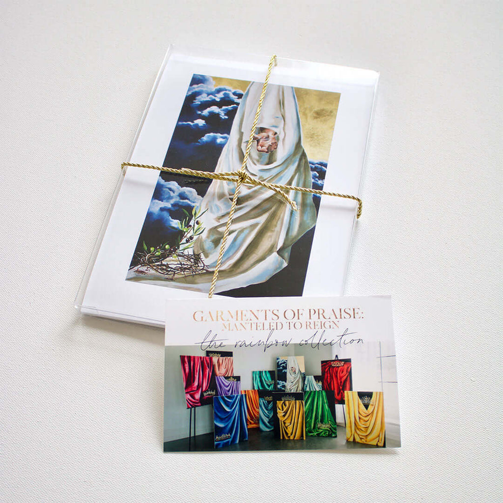 

A bundled paper print set tied with twine beside an information card.