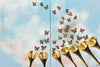 

A Call to Renaissance by Mindi Oaten: two coordinated artworks with golden trumpets and rising monarch butterflies.